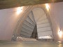 Stylish, finished concrete stairs with curved half landing.