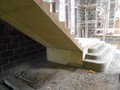 wider stair at the base with a number of wrap around treads/risers