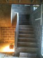 solid concrete balustrade on the internal string of the stairs, 900 mm high