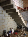 1 metre wide stair adjacent to a wall. the soffit matches the tread riser profile.